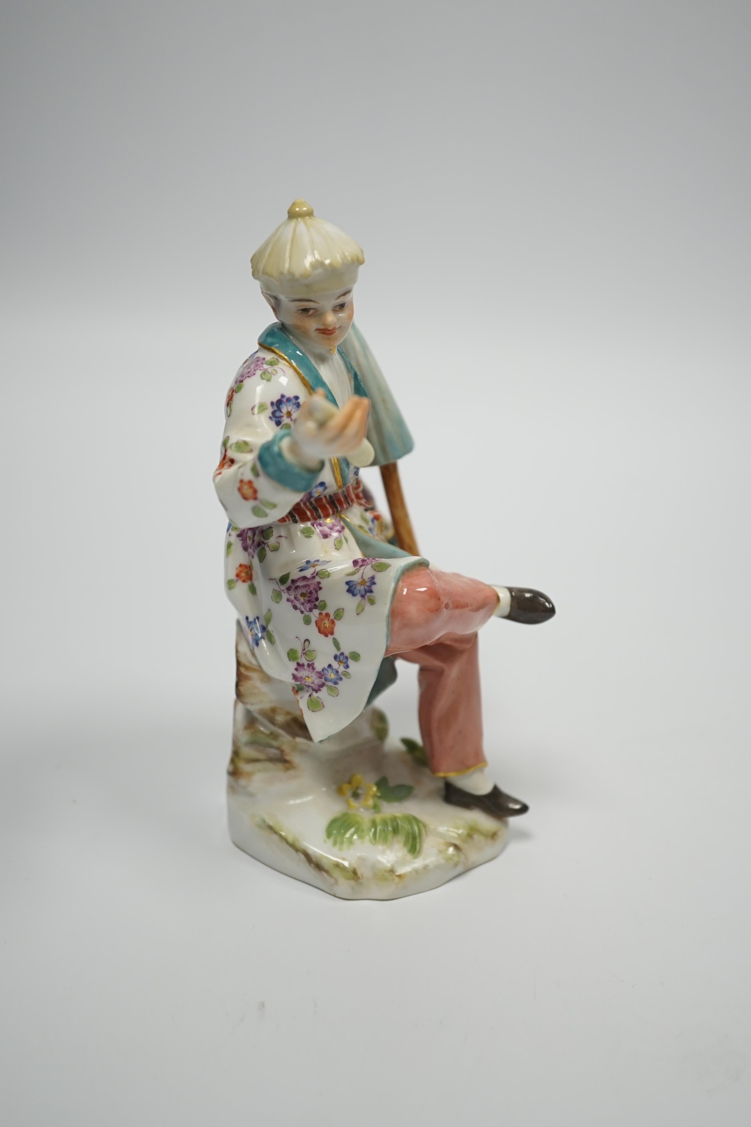 A Meissen figure of a seated Chinese man, 20th century, 14cm high